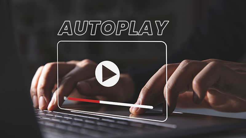  Hands typing on a laptop with a video player graphic overlay and 'Autoplay' text, symbolizing the instant engagement of autoplay videos in digital marketing.

